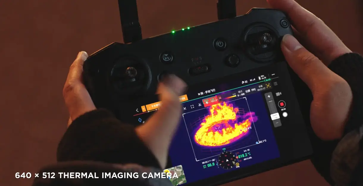 Person operating thermal imaging drone controller